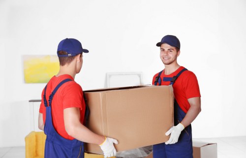 Professional movers handling furniture