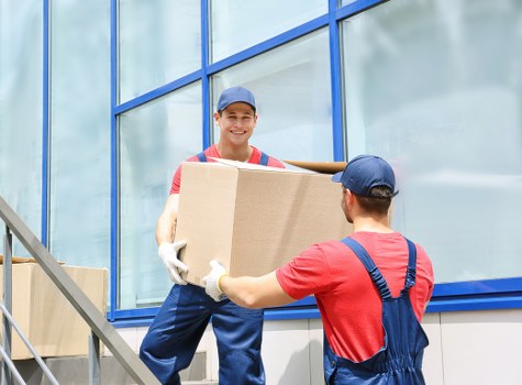 Professional movers handling household items