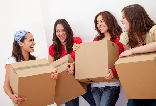 Professional movers packing items securely