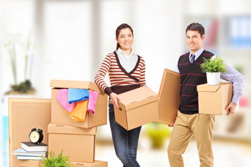 Professional movers handling residential items