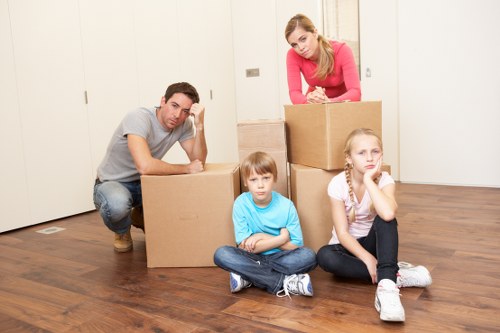 Experienced team unloading furniture at new home