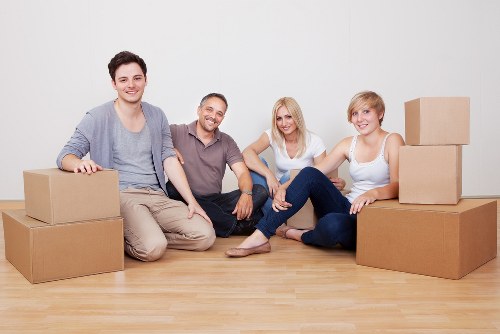 Professional movers handling furniture